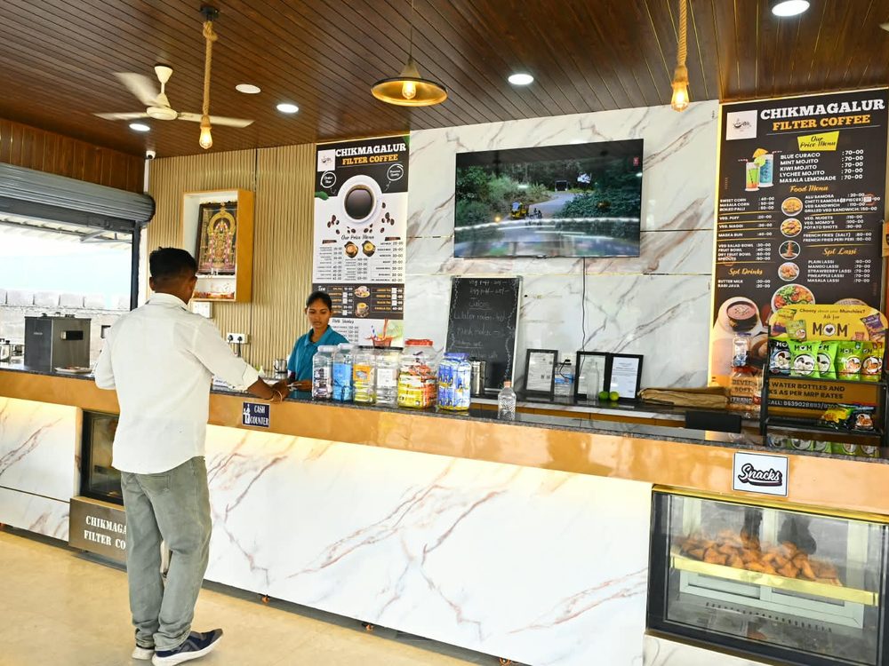Staff serving a customer at the counter